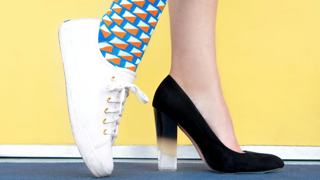 woman wearing sneaker and sandal